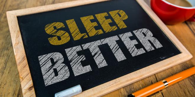 Small chalkboard with the message Sleep Better written in chalk on it.